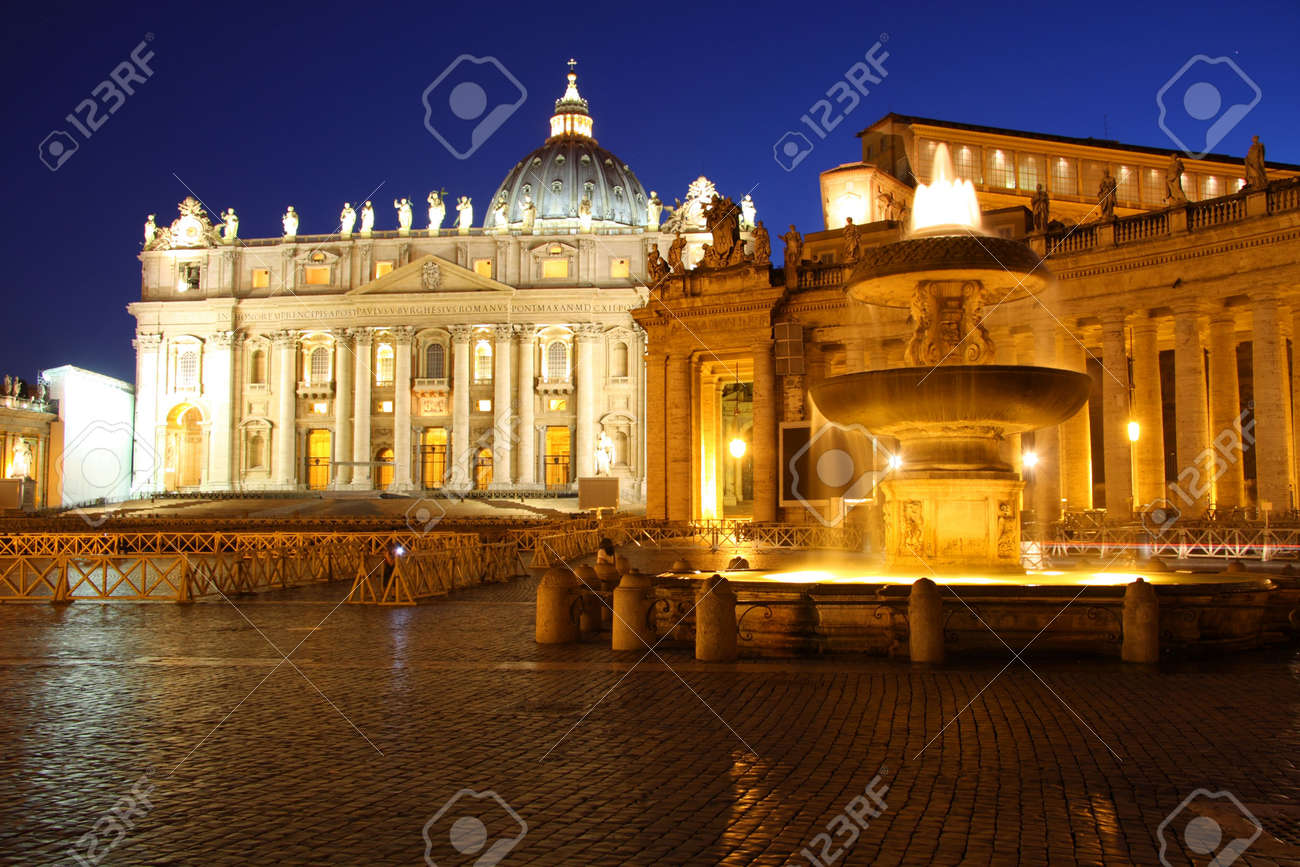 Nightshot of Saint Peter's Basilica with a fountain in front - 5052908 Nightshot of Saint Peter's Basilica with a fountain in front - 5052908