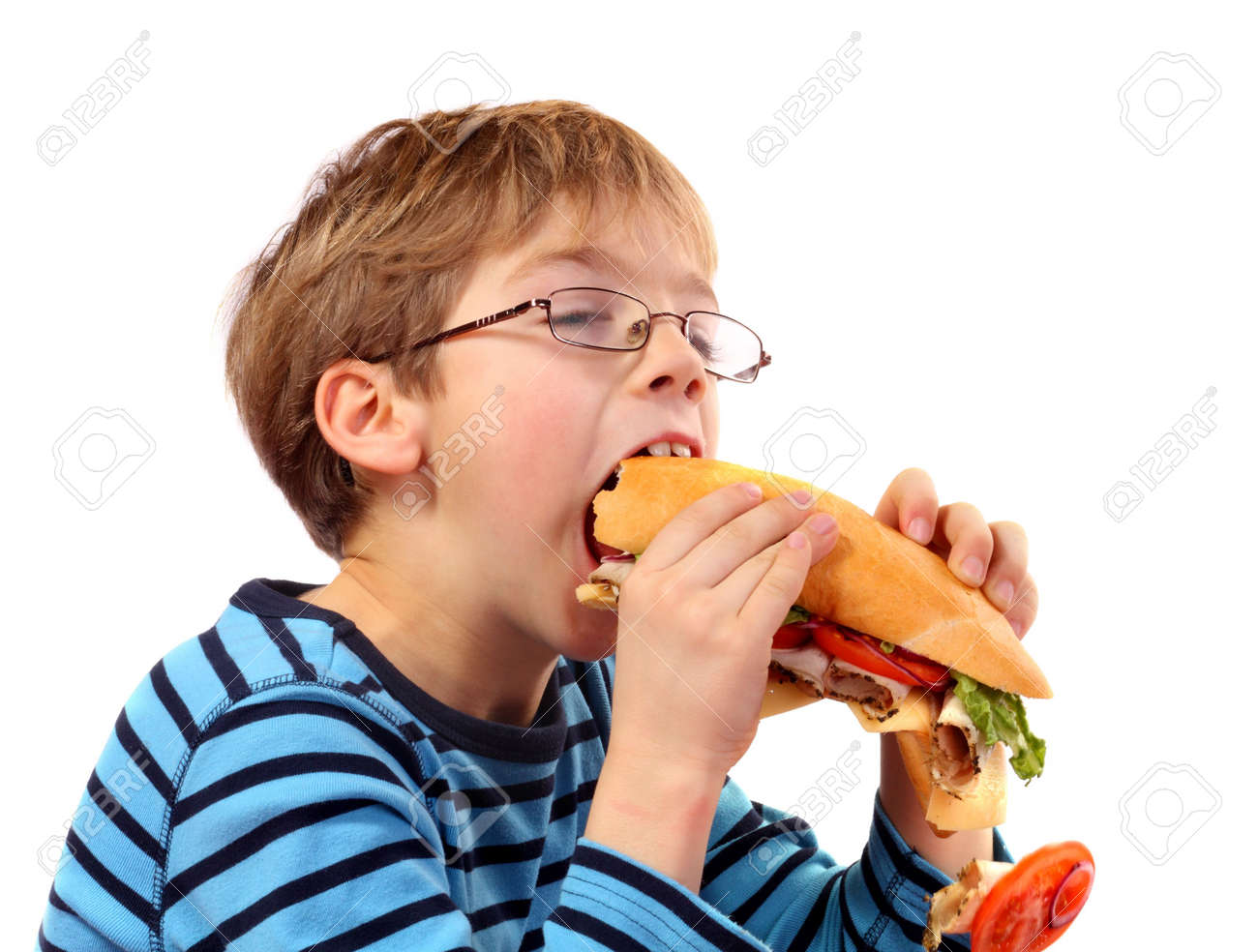 boy eating large sandwich on white background - 6860494 boy eating large sandwich on white background - 6860494