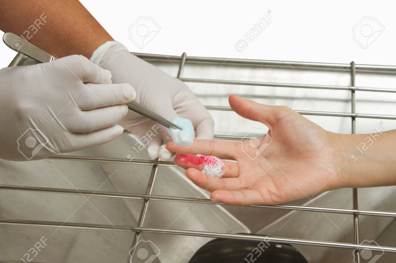 medical assistant changes the dressing of a wound at the emergency emergency room medical assistant