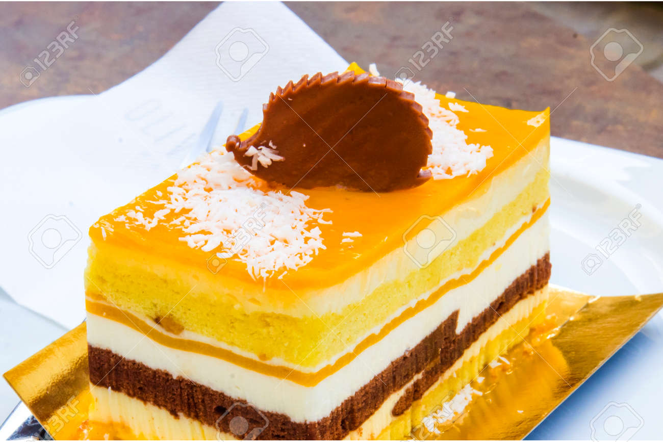 chocolate parfait, sponge cake, cream and mango with a milk chocolate hedgehog decoration - 145781621 chocolate parfait, sponge cake, cream and mango with a milk chocolate hedgehog decoration - 145781621