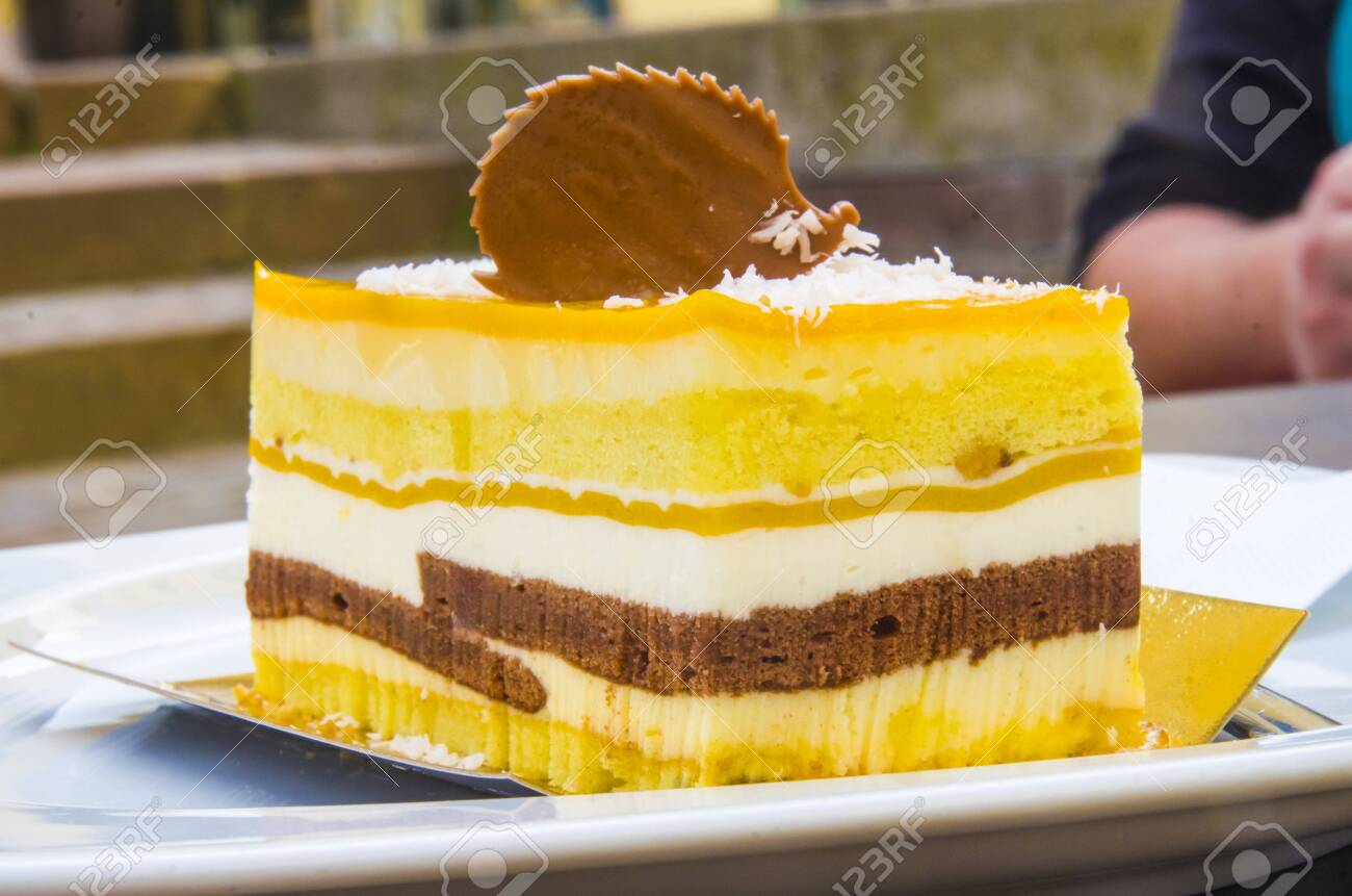 chocolate parfait, sponge cake, cream and mango with a milk chocolate hedgehog decoration - 145782234 chocolate parfait, sponge cake, cream and mango with a milk chocolate hedgehog decoration - 145782234