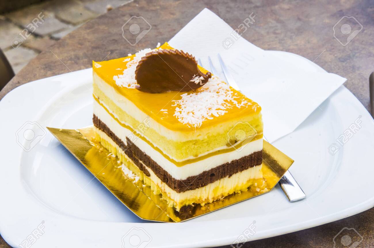 chocolate parfait, sponge cake, cream and mango with a milk chocolate hedgehog decoration - 145782235 chocolate parfait, sponge cake, cream and mango with a milk chocolate hedgehog decoration - 145782235