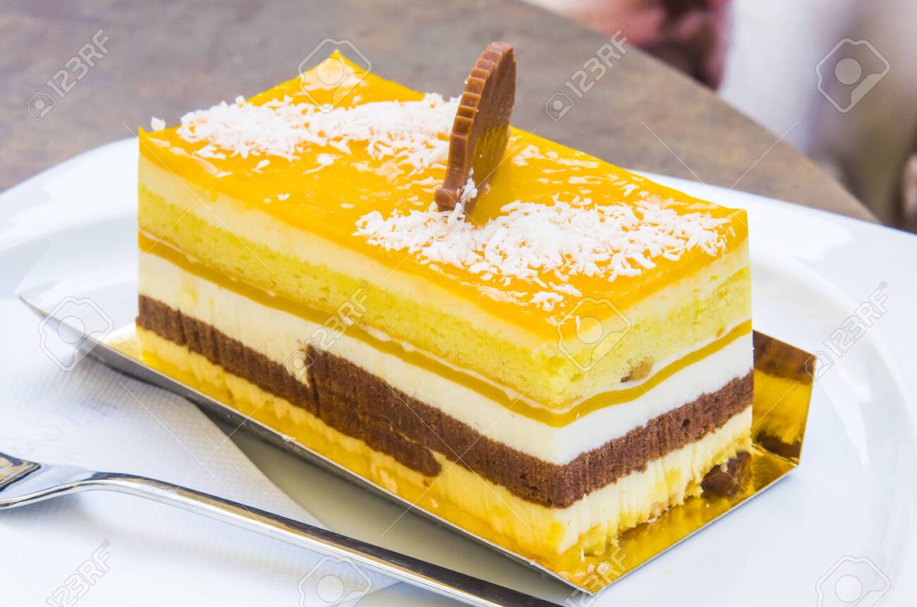 chocolate parfait, sponge cake, cream and mango with a milk chocolate hedgehog decoration - 145782238 chocolate parfait, sponge cake, cream and mango with a milk chocolate hedgehog decoration - 145782238