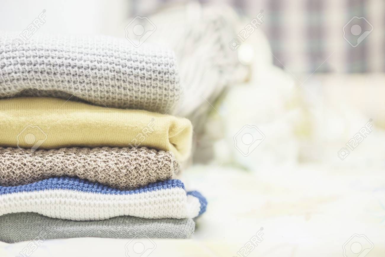 Winter clothes,Stack of clothes from knitted knitwear,vintage.. Winter clothes,Stack of clothes from knitted knitwear,vintage..
