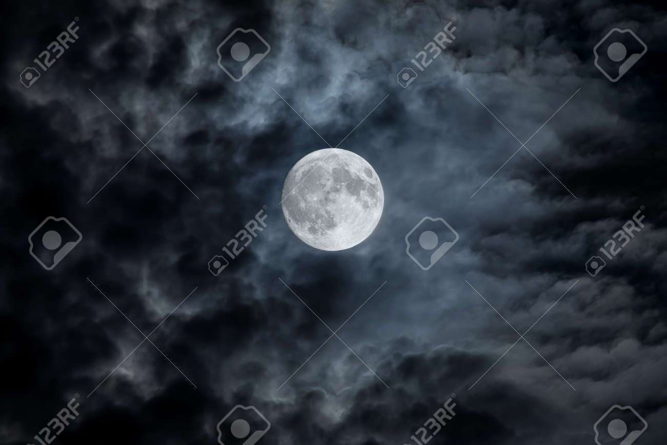Full Moon At Night. The Illuminated Face Of The Moon Is Wrapped In A Cloud  Cover That Covers It In A Veiled Way. Stock Photo, Picture and Royalty Free  Image. Image 190114544., image size:1300x867