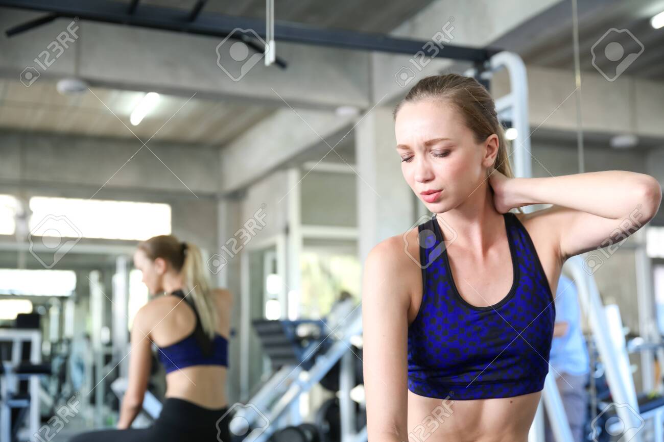 Young women are experiencing muscle aches from excessive exercise. - 143799917 Young women are experiencing muscle aches from excessive exercise. - 143799917