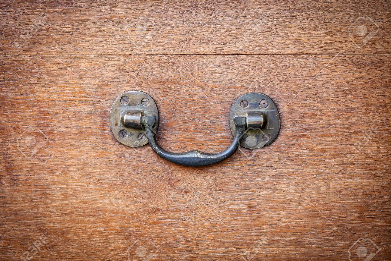 Brass Side Handle Of Vintage Wooden Chest. Antique Furniture.. Stock Brass side handle of vintage wooden chest. Antique furniture hardware detail. Stock Photo - - Brass Side Handle Of Vintage Wooden Chest. Antique Furniture.. Stock