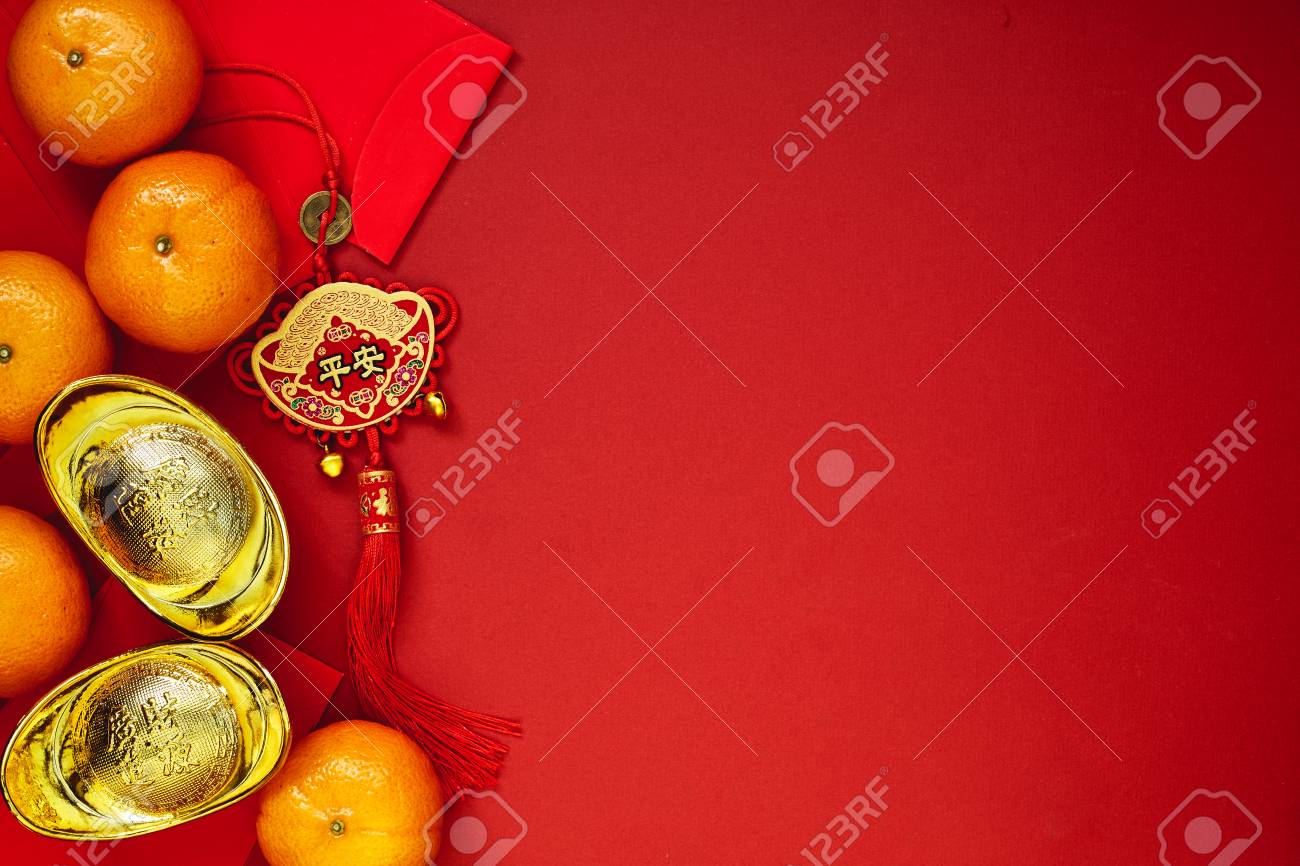 Chinese coins of luck or chinese knot and Chinese gold ingots and Traditional chinese knot (Foreign text means blessing) and Red envelopes and decoration with Fresh oranges on Red Paper background - 89269062 Chinese coins of luck or chinese knot and Chinese gold ingots and Traditional chinese knot (Foreign text means blessing) and Red envelopes and decoration with Fresh oranges on Red Paper background - 89269062