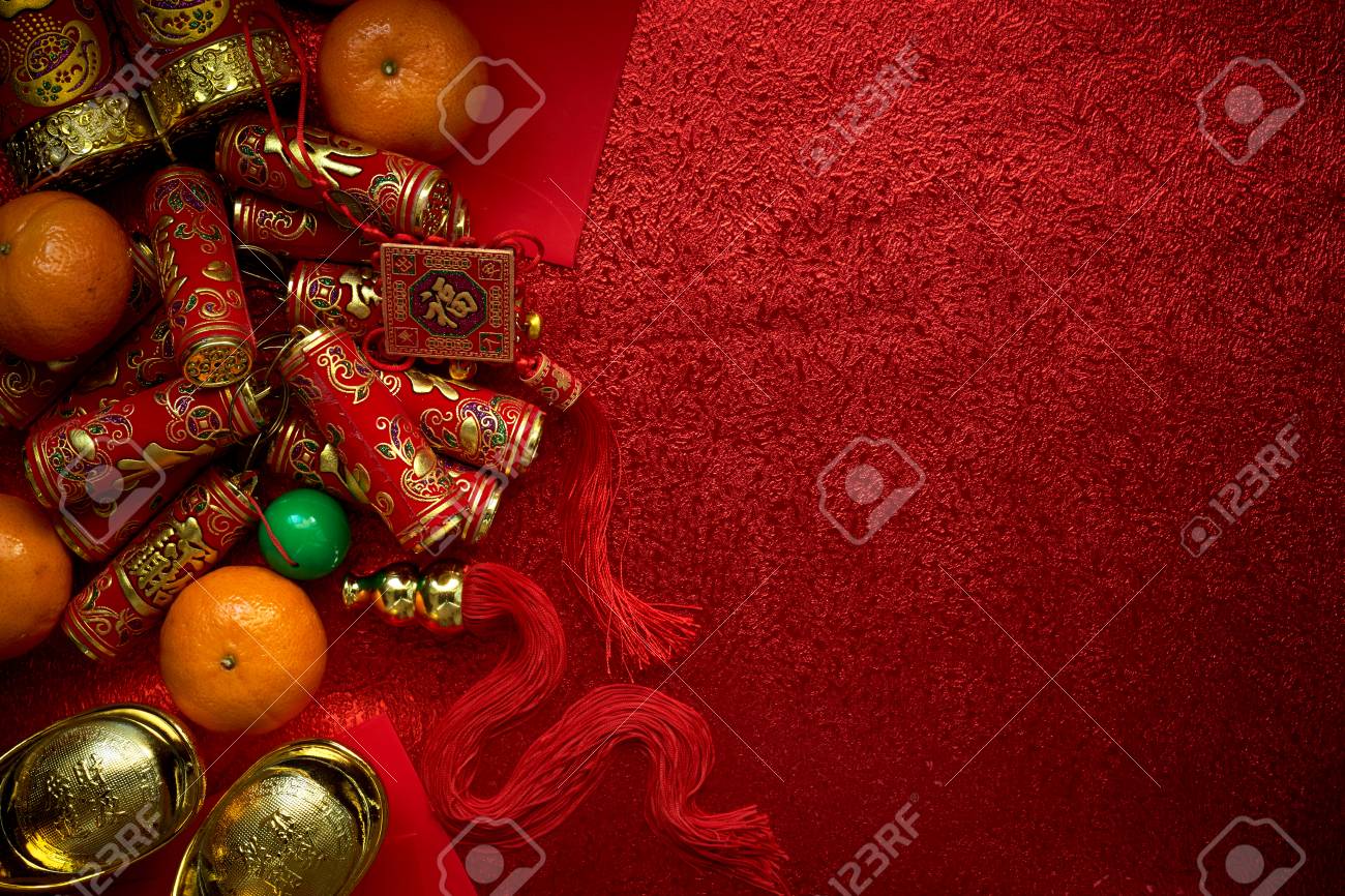 Chinese coins or Chinese knot of luck and chinese firecrackers and Chinese gold ingots and Traditional chinese knot (Foreign text means blessing) and Red envelopes and decoration with Fresh oranges on Red Paper background - 89269223 Chinese coins or Chinese knot of luck and chinese firecrackers and Chinese gold ingots and Traditional chinese knot (Foreign text means blessing) and Red envelopes and decoration with Fresh oranges on Red Paper background - 89269223