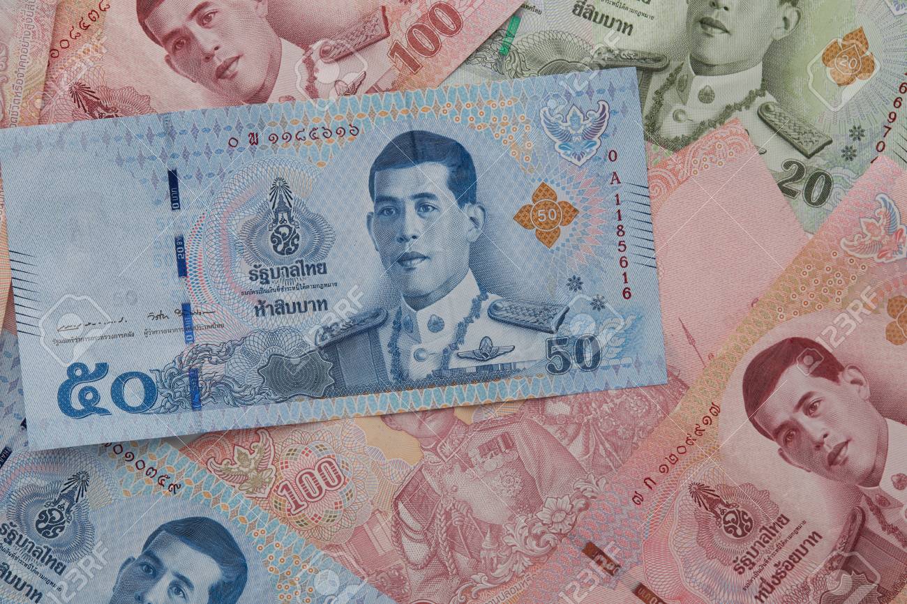 Close Up 20 50 100 Baht Hand Holding New Thai Baht Banknotes With The Image Of King Rama X On White Background Stock Photo Picture And Royalty Free Image Image 102574057