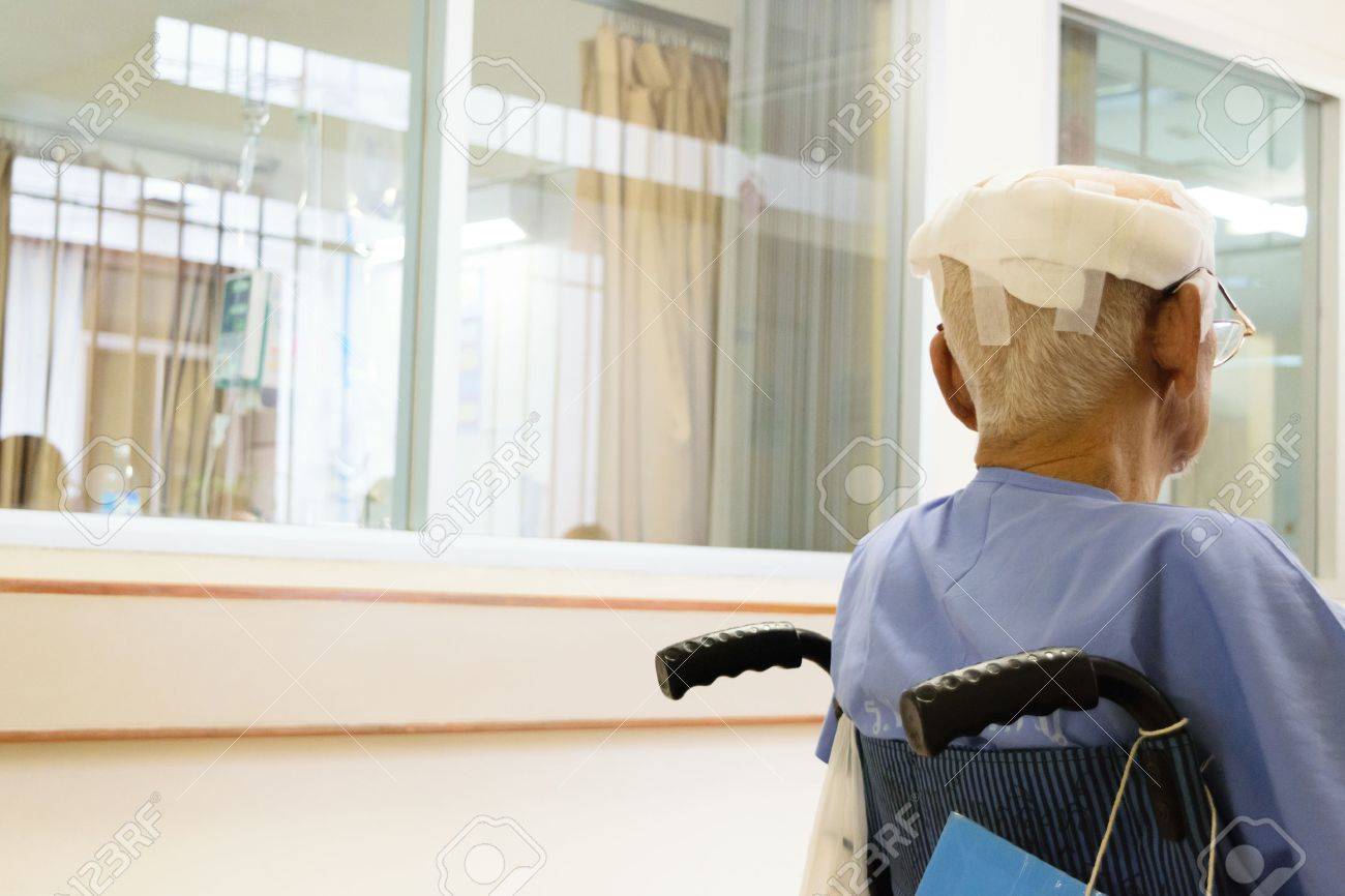 Patient elderly man with head injury on wheelchair in hospital - 43274203 Patient elderly man with head injury on wheelchair in hospital - 43274203