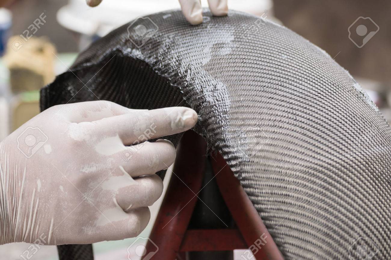 Wrapping carbon fiber or kevlar and man hand for working - 51555413 Wrapping carbon fiber or kevlar and man hand for working - 51555413