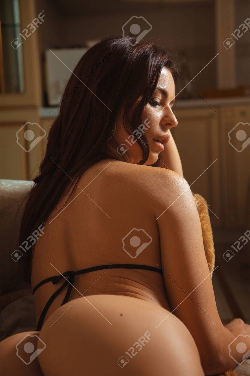 Seductive Brunette Woman Lying On Sofa. Sexual Woman. Seduction Woman. Hot  Woman In Lingerie. Stock Photo, Picture and Royalty Free Image. Image  52772488.