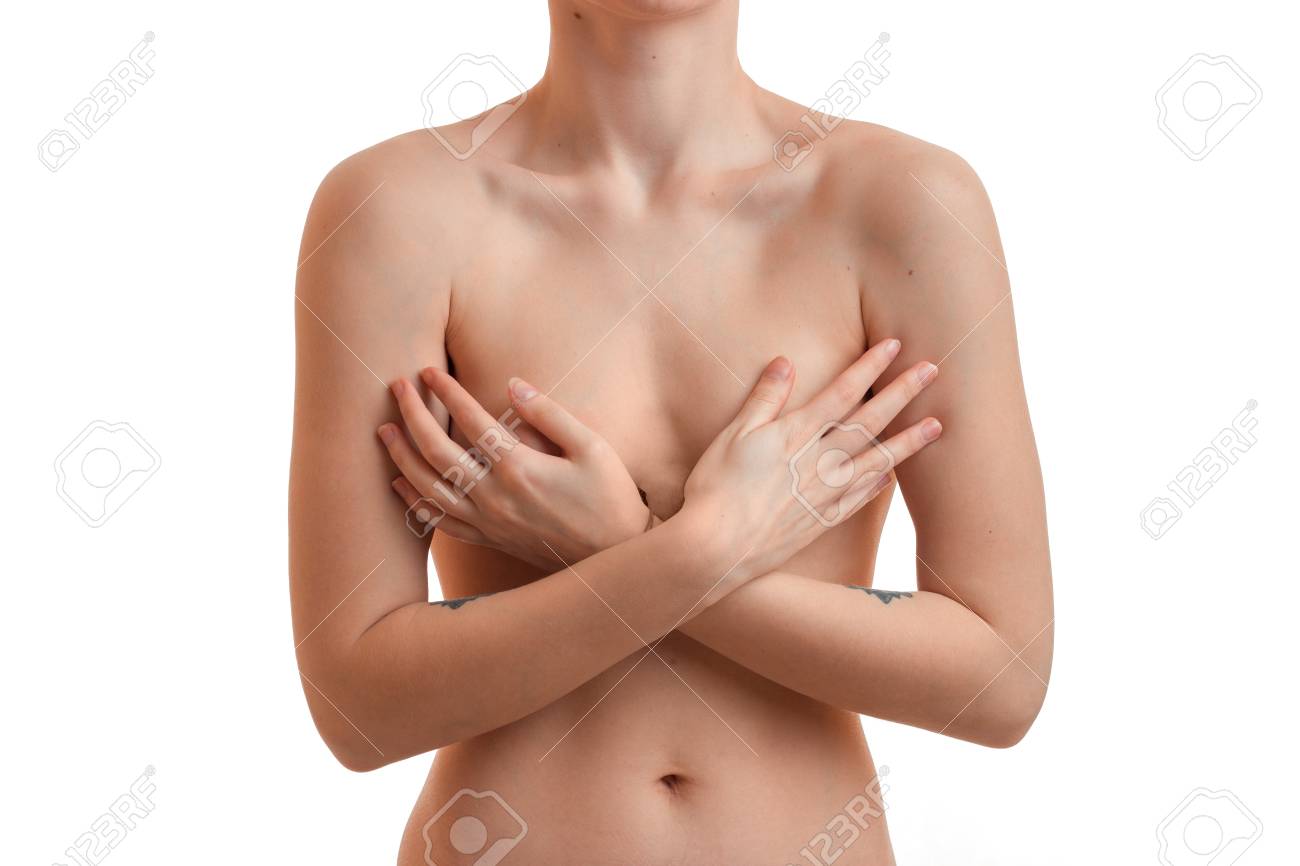 ヌードの女性は 白い背景で隔離の顔なしの手で彼女の胸を非表示に の写真素材 画像素材 Image