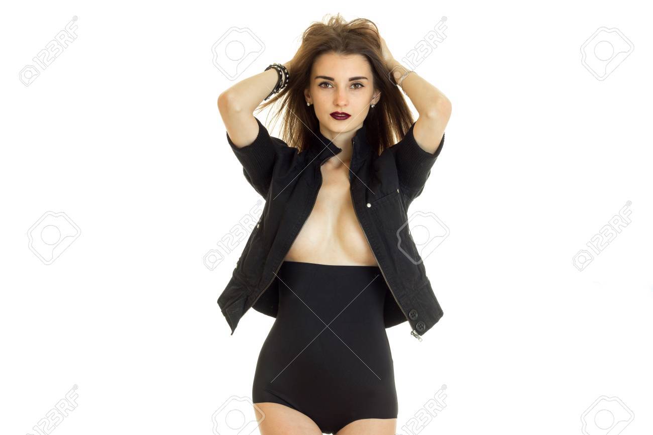 Mujer Joven En La Chaqueta Negra Sin Ropa Interior Mira A La Cámara Sobre Fondo Blanco Fotos, Retratos, Imágenes Y Fotografía De Archivo Libres De Derecho. Image 81111126.