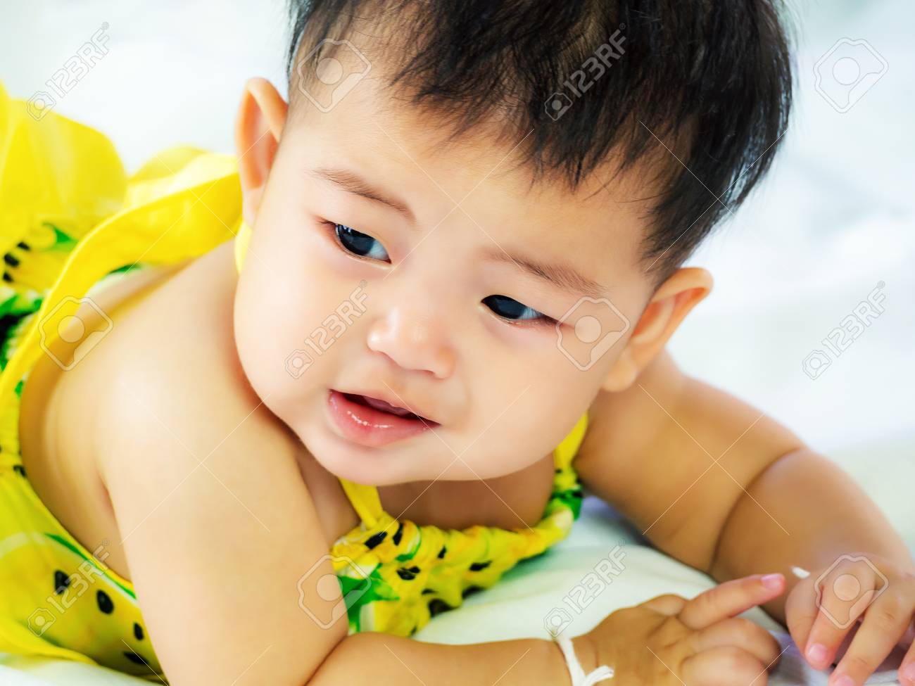 Portrait Of Cute Short Hair Asia Baby Girl In Color Full Wearing