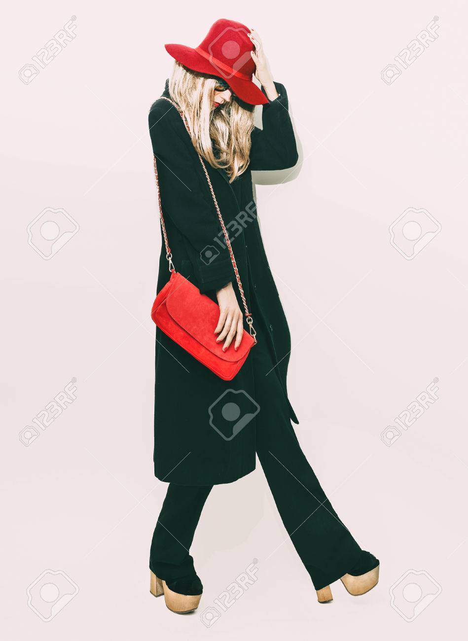 Glamorous fashion blond girl in classic black coat and red hat. autumn Style - 34313236 Glamorous fashion blond girl in classic black coat and red hat. autumn Style - 34313236