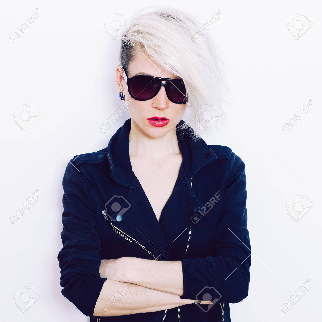 Blonde girl with trendy hairstyle and fashion sunglasses - 38635375 Blonde girl with trendy hairstyle and fashion sunglasses - 38635375
