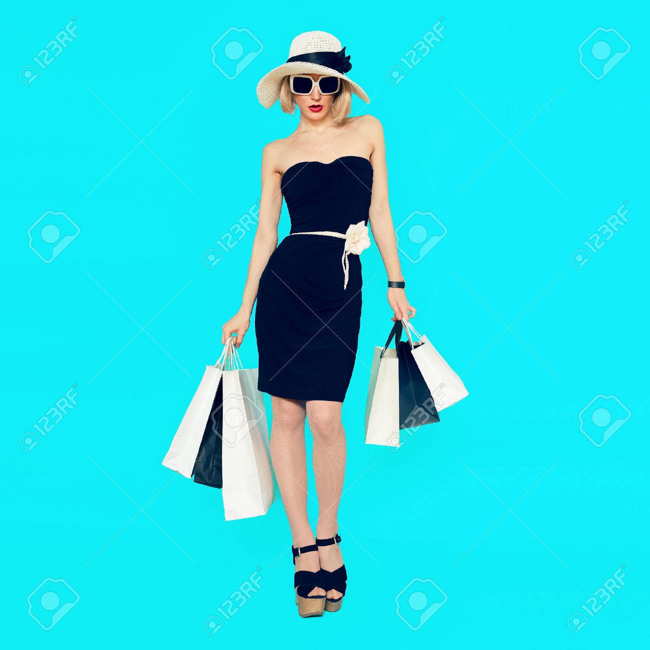 Stylish shopping lady with shopping bags on blue background - 44776668 Stylish shopping lady with shopping bags on blue background - 44776668
