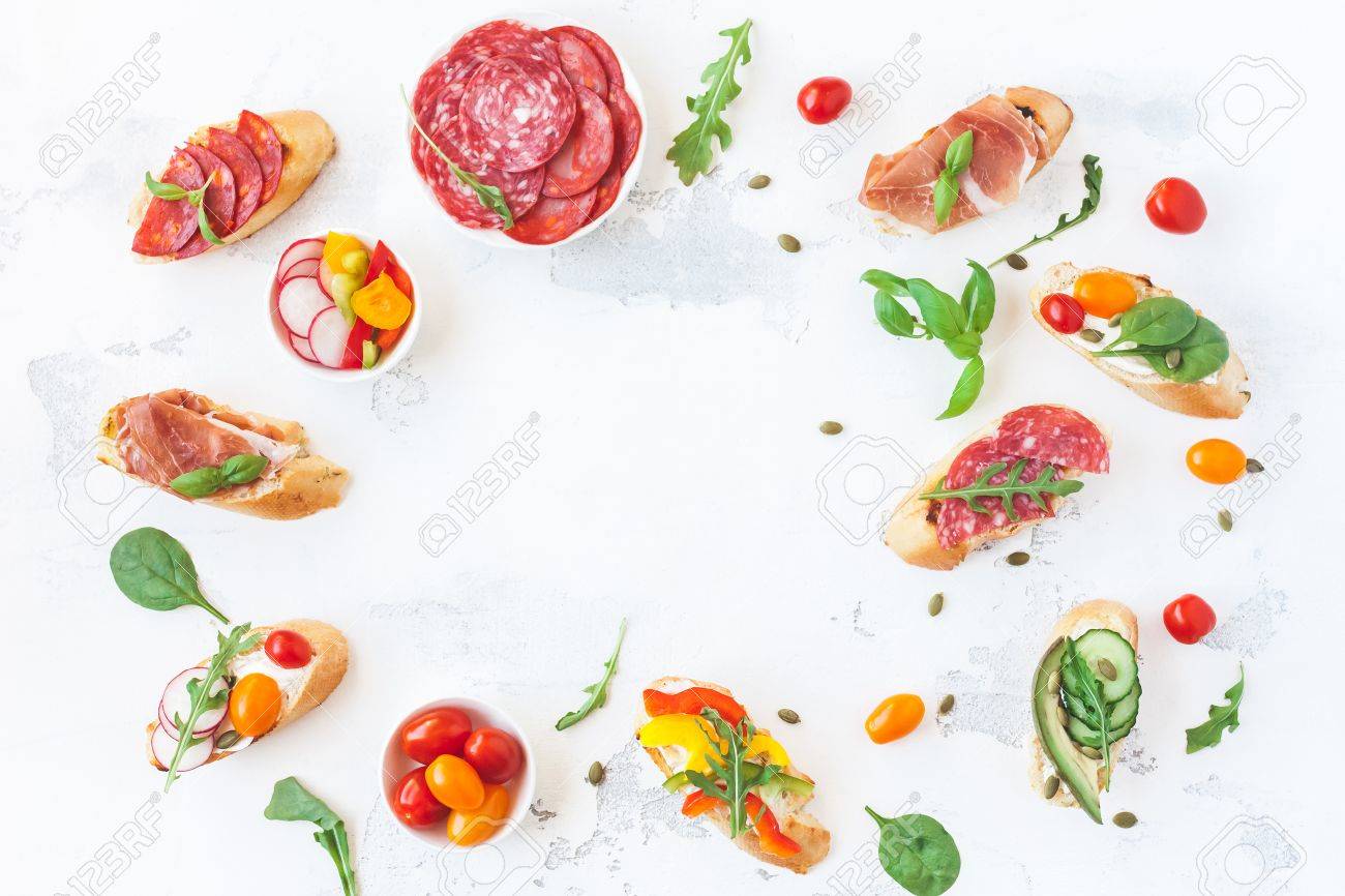 Traditional spanish tapas on white table. Flat lay, top view - 81781312 Traditional spanish tapas on white table. Flat lay, top view - 81781312