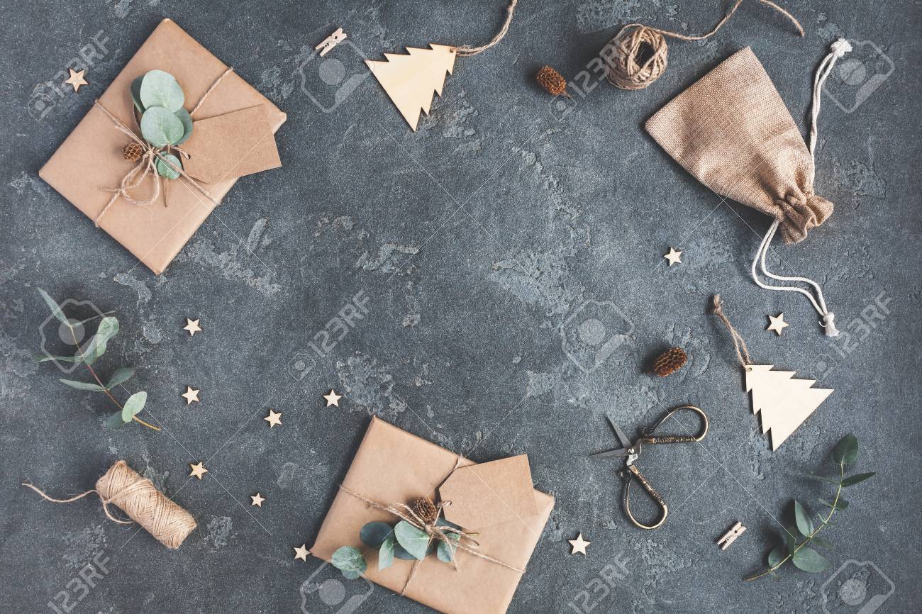 Christmas composition. Christmas gifts and eucalyptus branches on black background. Flat lay, top view, copy space - 86954467 Christmas composition. Christmas gifts and eucalyptus branches on black background. Flat lay, top view, copy space - 86954467