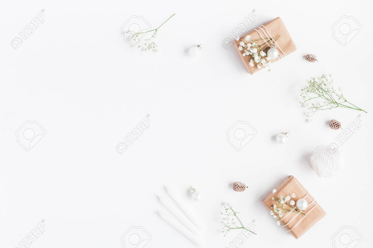 Christmas composition. Frame made of christmas gifts, pine cones, gypsophila flowers on white background. Flat lay, top view, copy space - 89713926 Christmas composition. Frame made of christmas gifts, pine cones, gypsophila flowers on white background. Flat lay, top view, copy space - 89713926