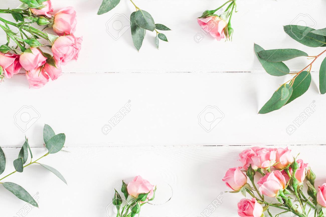 Flowers composition. Frame made of eucalyptus branches and pink rose flowers on white wooden background. Flat lay, top view, copy space - 93854917 Flowers composition. Frame made of eucalyptus branches and pink rose flowers on white wooden background. Flat lay, top view, copy space - 93854917