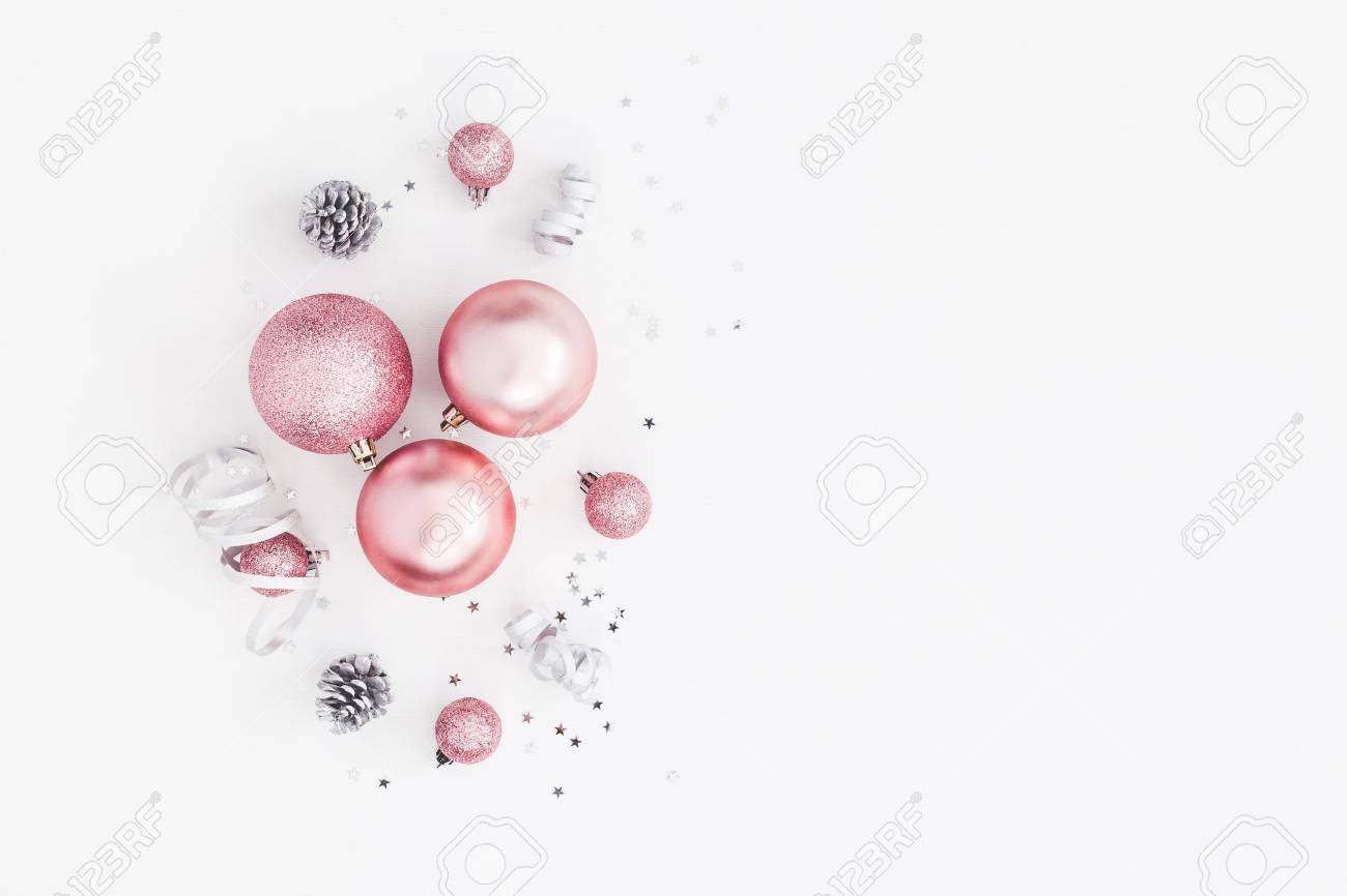 Christmas composition. Christmas balls, pink and silver decorations on white background. Flat lay, top view, copy space - 110544314 Christmas composition. Christmas balls, pink and silver decorations on white background. Flat lay, top view, copy space - 110544314