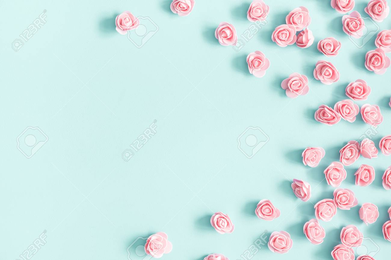 Flowers composition. Pink rose flowers on pastel blue background. Valentines day, mothers day, womens day, spring concept. Flat lay, top view, copy space - 117684536 Flowers composition. Pink rose flowers on pastel blue background. Valentines day, mothers day, womens day, spring concept. Flat lay, top view, copy space - 117684536