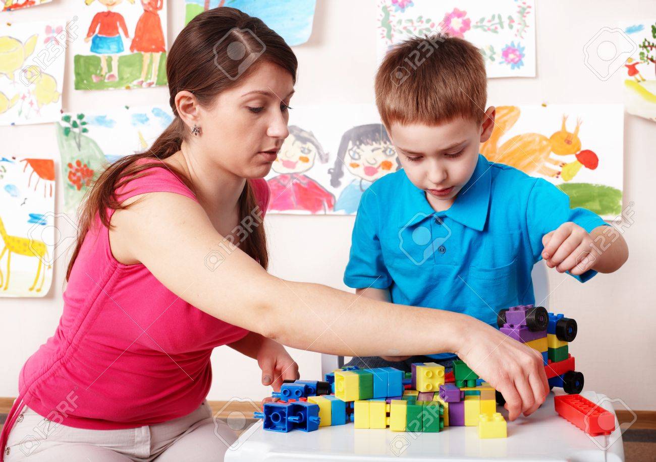 Child with construction in play room. Preschool. - 8332758 Child with construction in play room. Preschool. - 8332758