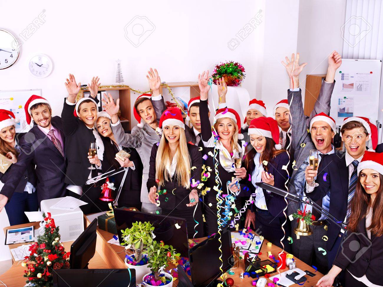 Happy business group people in santa hat at Xmas party. - 24041188 Happy business group people in santa hat at Xmas party. - 24041188