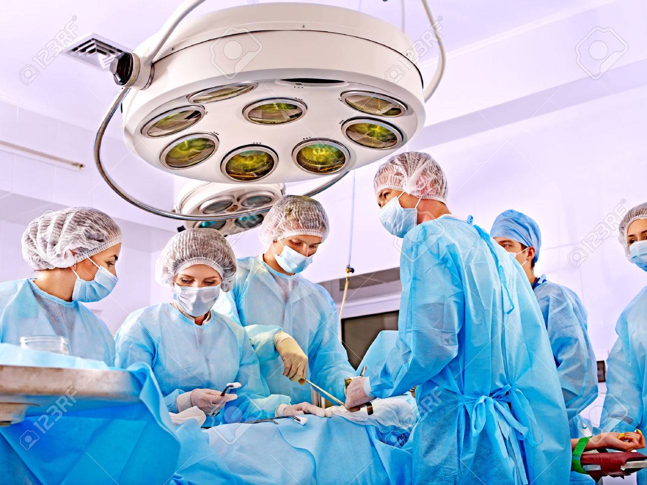 Team surgeon at work in operating room. - 27460716 Team surgeon at work in operating room. - 27460716