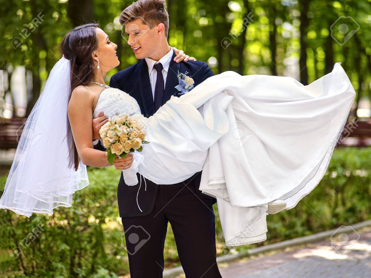 Bride and groom with flower summer outdoor. - 37457361 Bride and groom with flower summer outdoor. - 37457361