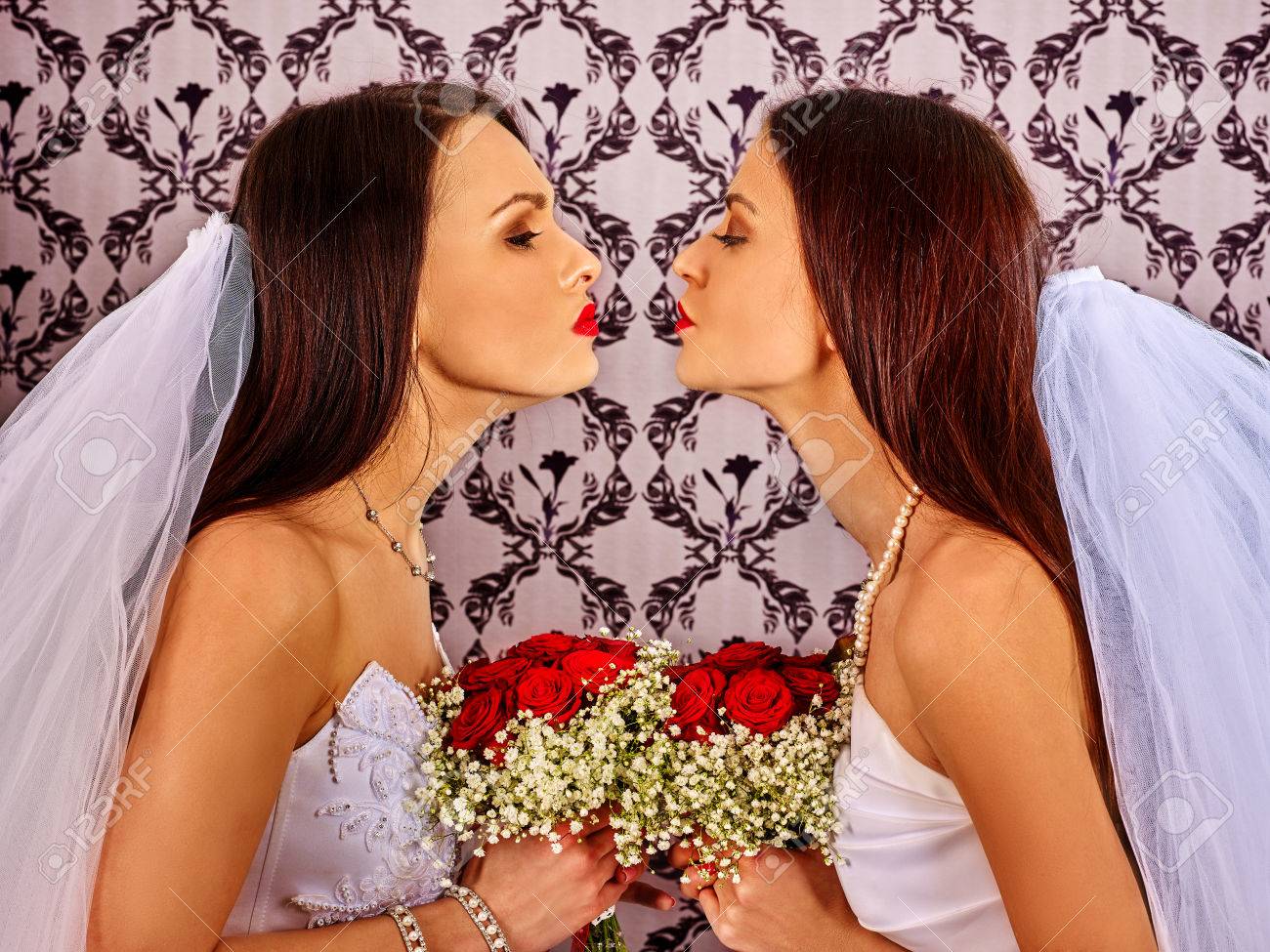 Lesbian kissing in dress