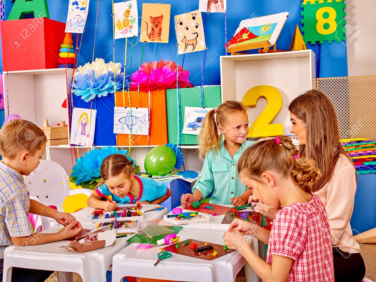Lasrge Group beauty kids sculpt by plasticine on table in kindergarten . - 48495029 Lasrge Group beauty kids sculpt by plasticine on table in kindergarten . - 48495029