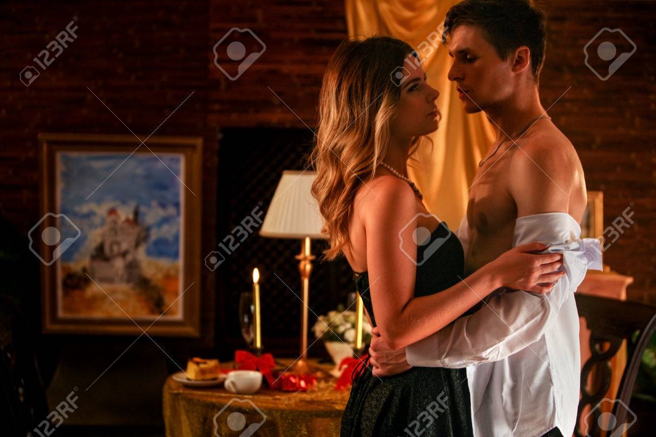 Couple in love dancing and kissing into luxury restaurant. - 63299837 Couple in love dancing and kissing into luxury restaurant. - 63299837