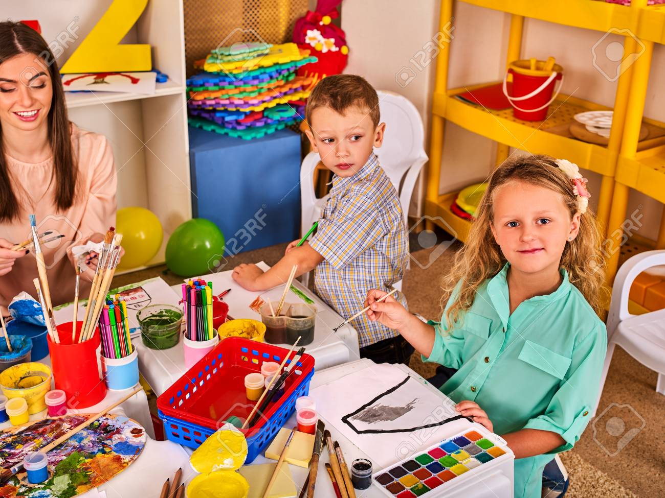 kids playroom organization of children painting and drawing in kids club craft lesson in primary - Children Painting Images kids playroom organization of children painting and drawing in kids club craft lesson in primary - Children Painting Images