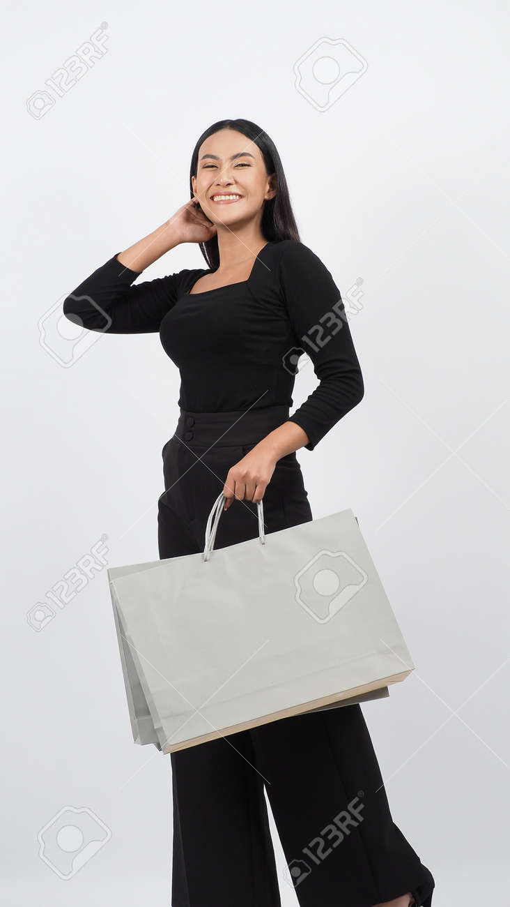 Love Shopping concept. Beautiful Asian woman carrying gray color bags shopping online. isolated on white studio background. online shopping bag. black hair woman love shopping online. Online purchase - 168300583 Love Shopping concept. Beautiful Asian woman carrying gray color bags shopping online. isolated on white studio background. online shopping bag. black hair woman love shopping online. Online purchase - 168300583