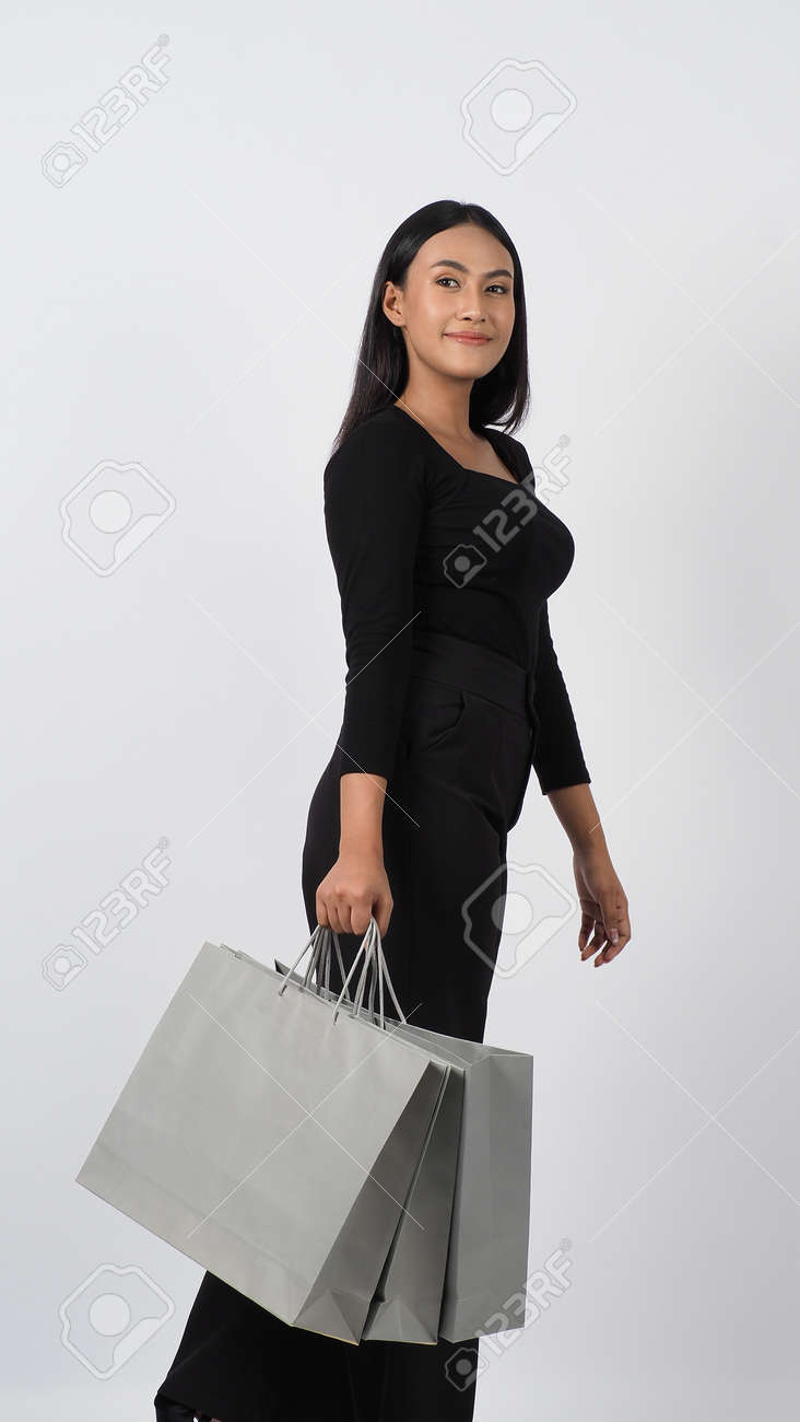 Love Shopping concept. Beautiful Asian woman carrying gray color bags shopping online. isolated on white studio background. online shopping bag. black hair woman love shopping online. Online purchase - 168300588 Love Shopping concept. Beautiful Asian woman carrying gray color bags shopping online. isolated on white studio background. online shopping bag. black hair woman love shopping online. Online purchase - 168300588