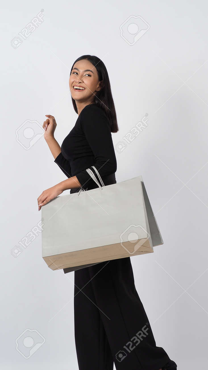 Love Shopping concept. Beautiful Asian woman carrying gray color bags shopping online. isolated on white studio background. online shopping bag. black hair woman love shopping online. Online purchase - 168300605 Love Shopping concept. Beautiful Asian woman carrying gray color bags shopping online. isolated on white studio background. online shopping bag. black hair woman love shopping online. Online purchase - 168300605