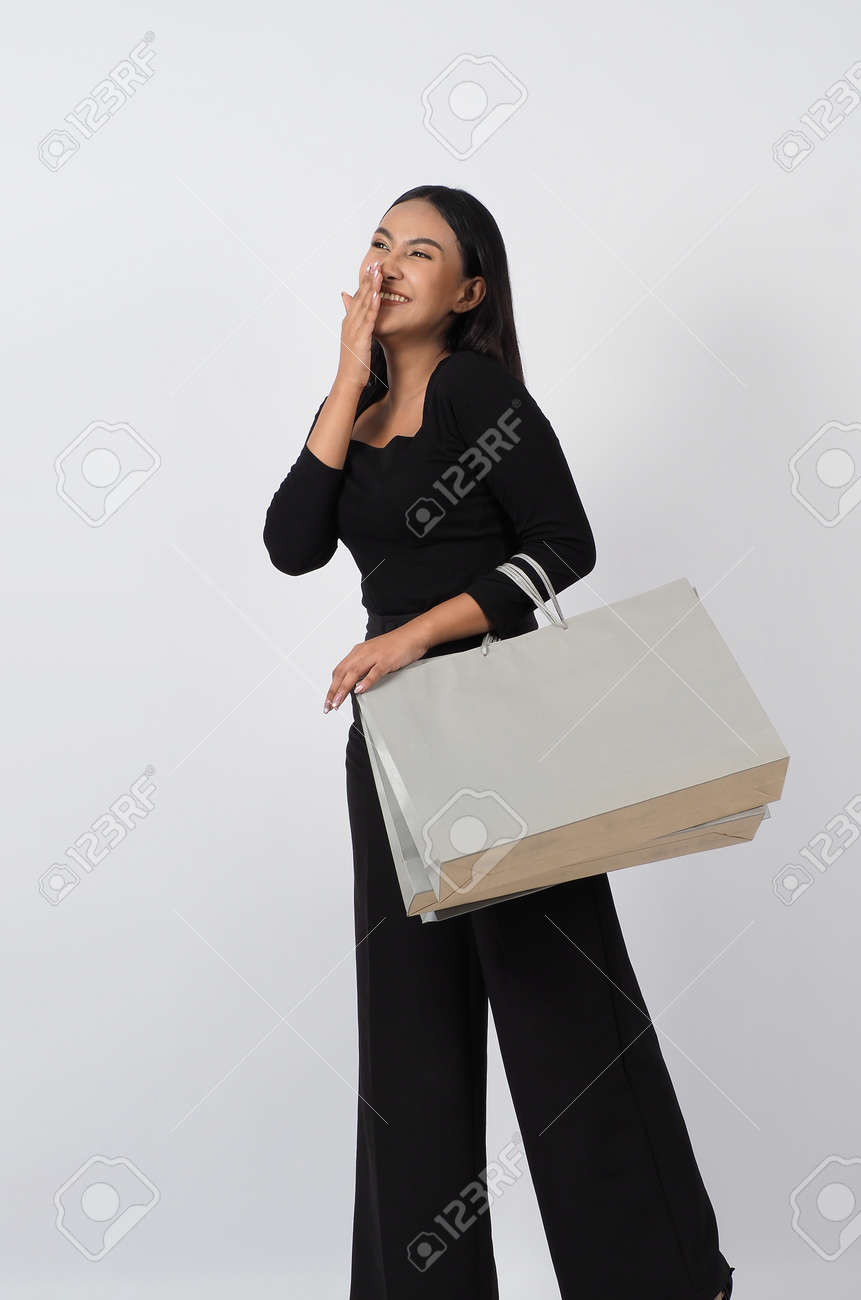 Love Shopping concept. Beautiful Asian woman carrying gray color bags shopping online. isolated on white studio background. online shopping bag. black hair woman love shopping online. Online purchase - 168301076 Love Shopping concept. Beautiful Asian woman carrying gray color bags shopping online. isolated on white studio background. online shopping bag. black hair woman love shopping online. Online purchase - 168301076
