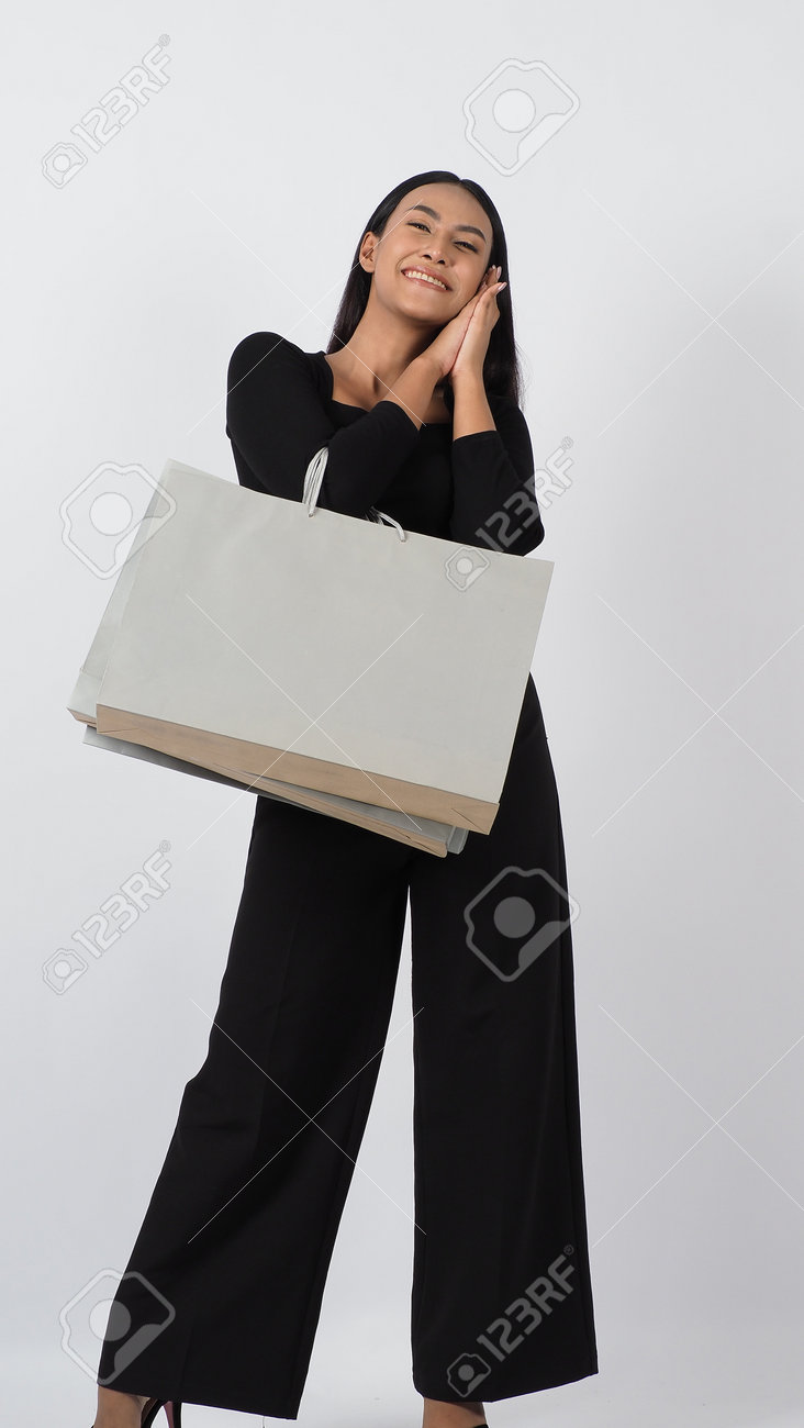 Love Shopping concept. Beautiful Asian woman carrying gray color bags shopping online. isolated on white studio background. online shopping bag. black hair woman love shopping online. Online purchase - 168301078 Love Shopping concept. Beautiful Asian woman carrying gray color bags shopping online. isolated on white studio background. online shopping bag. black hair woman love shopping online. Online purchase - 168301078
