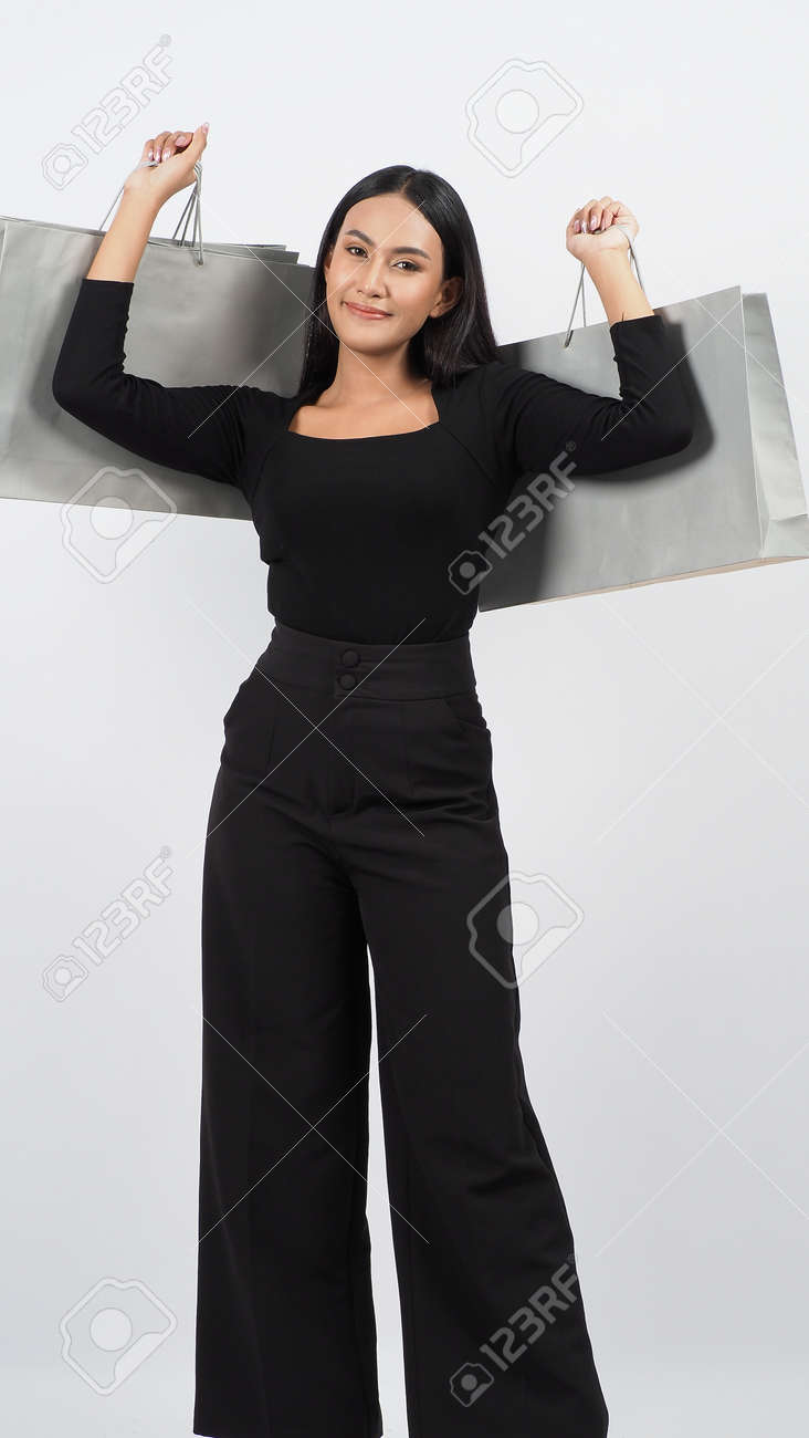 Love Shopping concept. Beautiful Asian woman carrying gray color bags shopping online. isolated on white studio background. online shopping bag. black hair woman love shopping online. Online purchase - 168301080 Love Shopping concept. Beautiful Asian woman carrying gray color bags shopping online. isolated on white studio background. online shopping bag. black hair woman love shopping online. Online purchase - 168301080