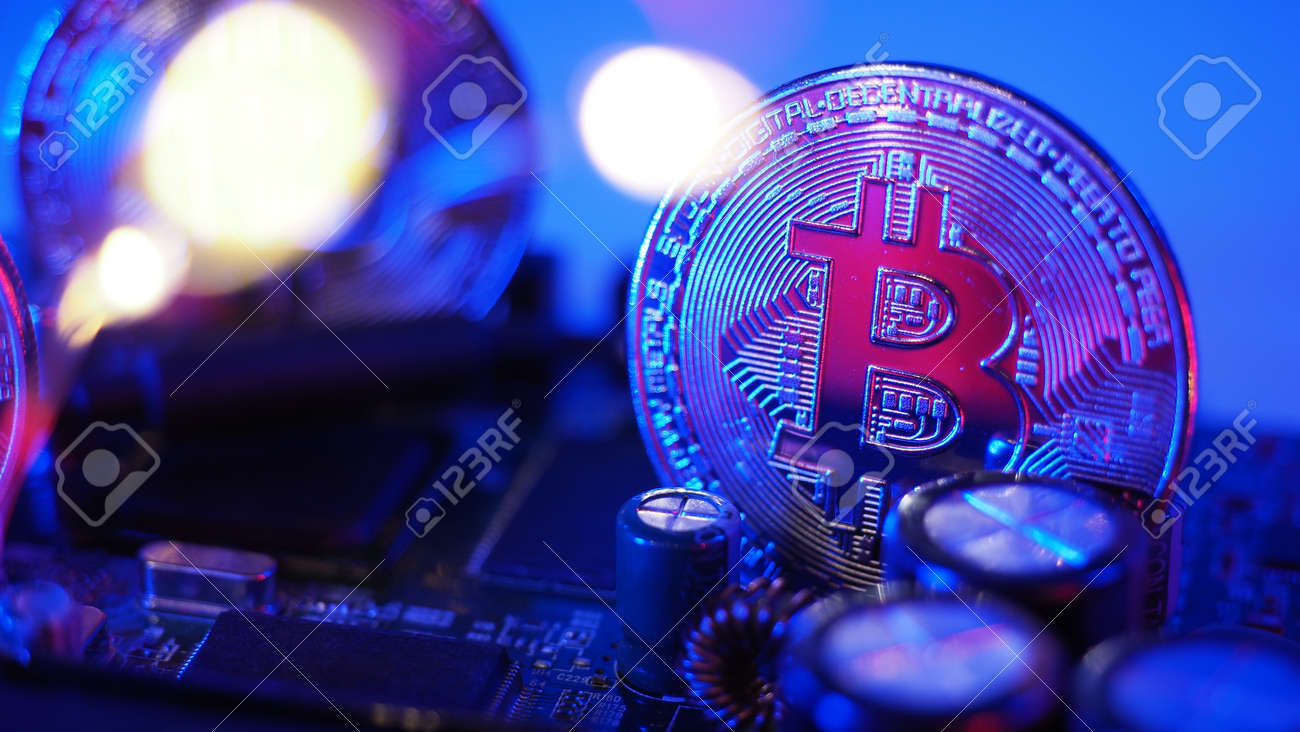 Bitcoin On Circuit Board. Cryptocurrency Bit-coins And Computer Mainboard.  Digital Money Currency Bitcoins Or BTC And Cyber Micro Chip. Pink Blue  Color On Background. Virtual Money Asset Investment. Stock Photo, Picture  and