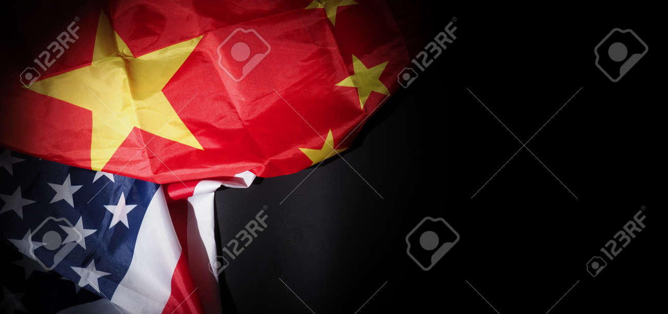 USA and China flag on black background. Represent serious trade tension or trade war between America and China. financial concept. Flags of China and the United States of America on Black. top view angle. - 170314452 USA and China flag on black background. Represent serious trade tension or trade war between America and China. financial concept. Flags of China and the United States of America on Black. top view angle. - 170314452