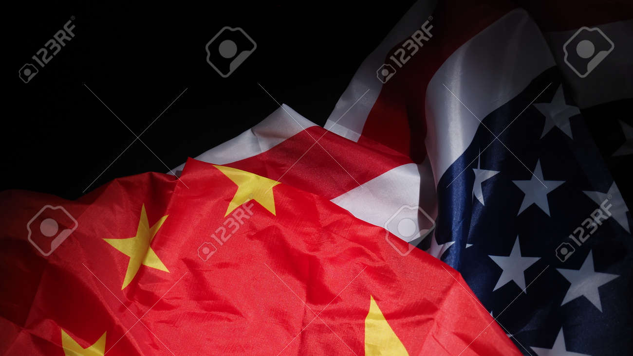 USA and China flag on black background. Represent serious trade tension or trade war between America and China. financial concept. Flags of China and the United States of America on Black. top view angle. - 170314454 USA and China flag on black background. Represent serious trade tension or trade war between America and China. financial concept. Flags of China and the United States of America on Black. top view angle. - 170314454
