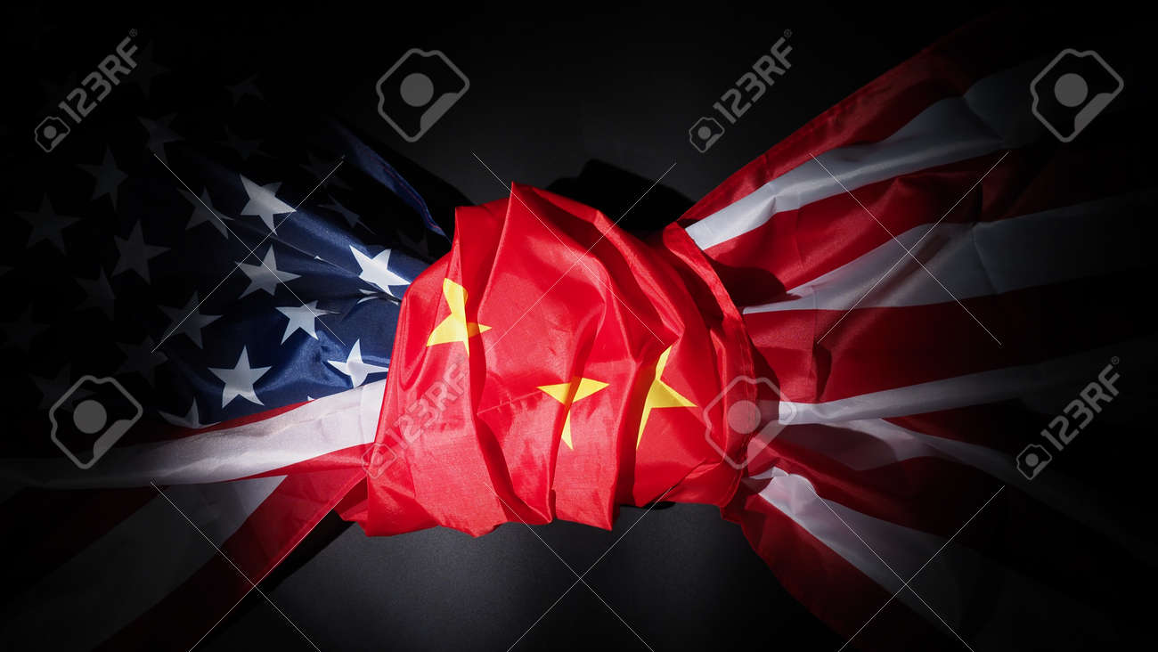 USA and China flag on black background. Represent serious trade tension or trade war between America and China. financial concept. Flags of China and the United States of America on Black. top view angle. - 170314459 USA and China flag on black background. Represent serious trade tension or trade war between America and China. financial concept. Flags of China and the United States of America on Black. top view angle. - 170314459