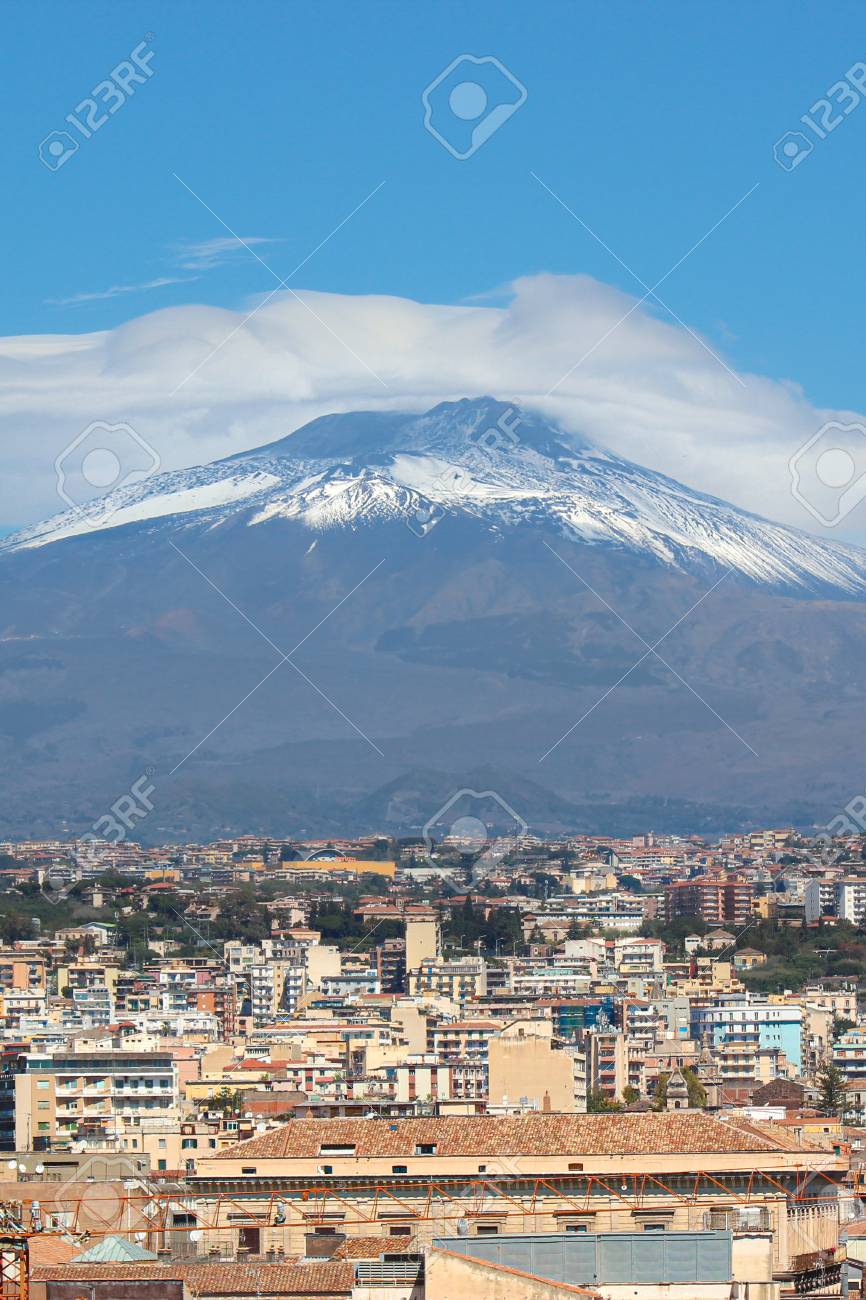 Famous Mount Etna Volcano In Sicily, Italy Captured On Vertical Picture  With Houses Belonging To City Catania Located At The Foot Of The Mountain.  Popular Tourist Spot. Stock Photo, Picture and Royalty, image size:866x1300