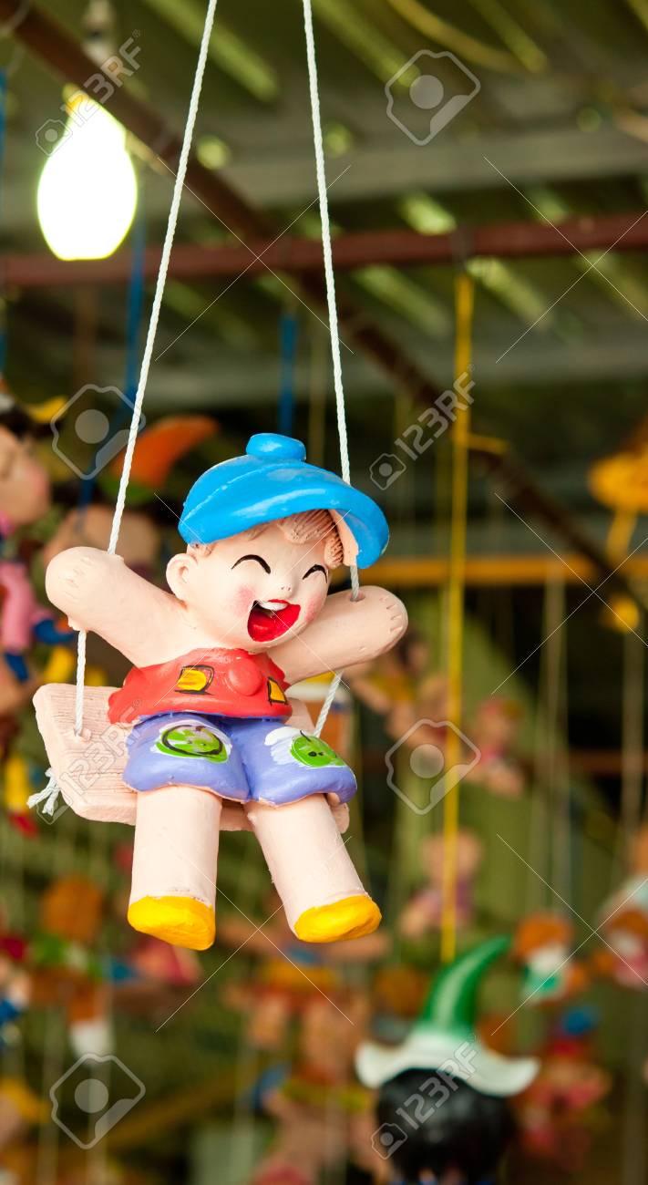 doll on a swing