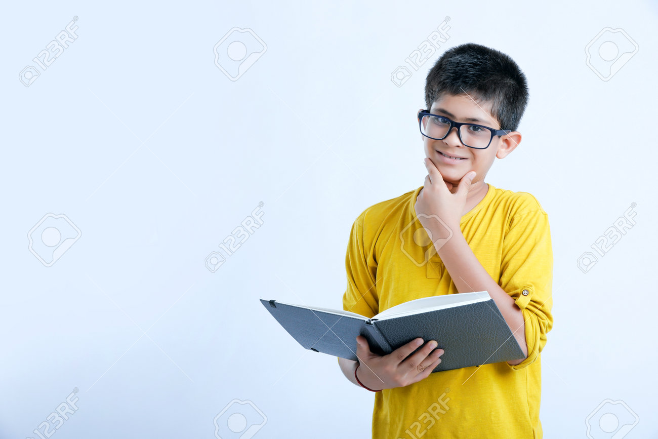 Young Indian Cute Child Reading A Book Stock Photo, Picture and Royalty  Free Image. Image 164479217., image size:1300x867